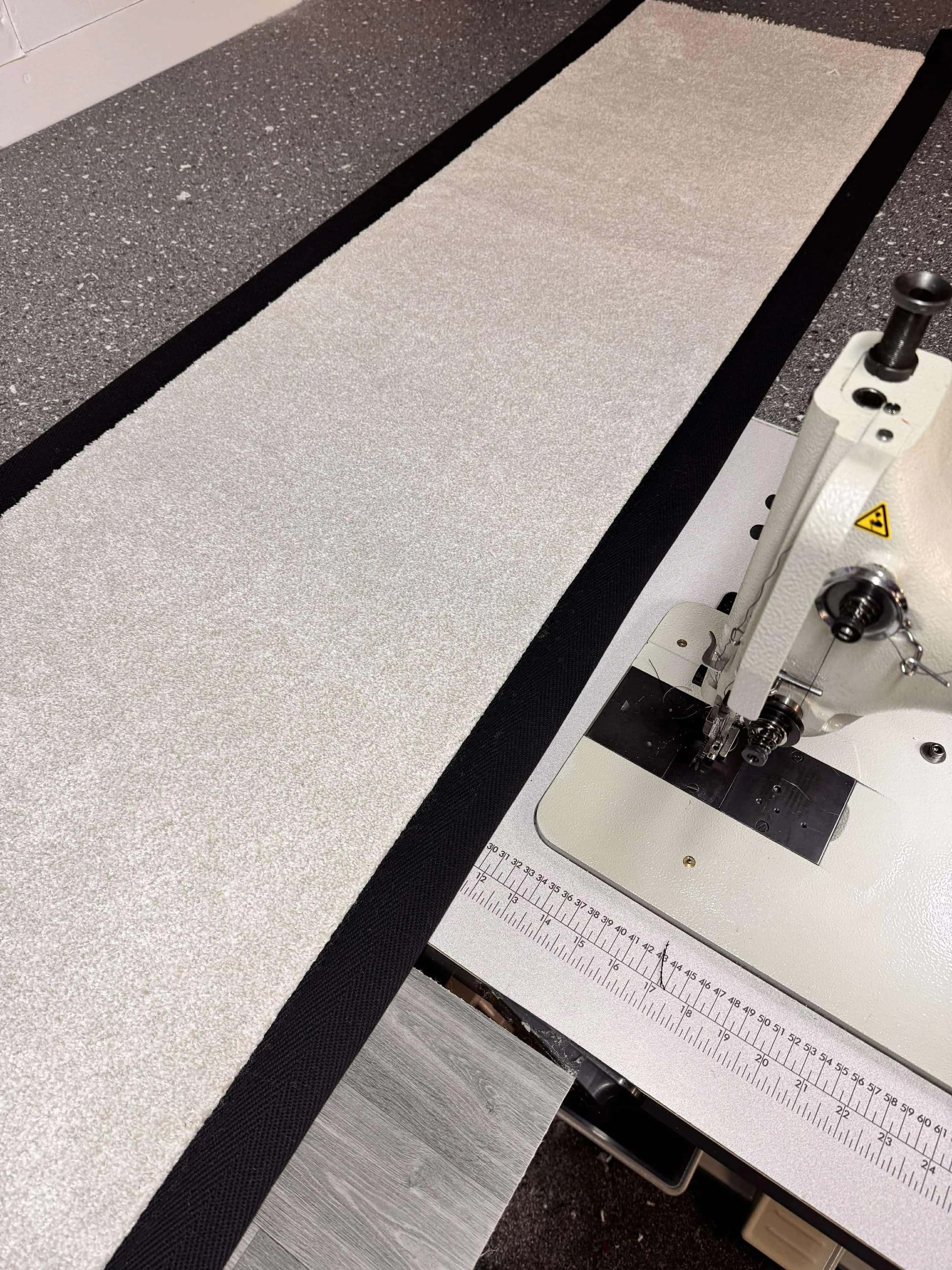 A carpet edge running through the binding machine