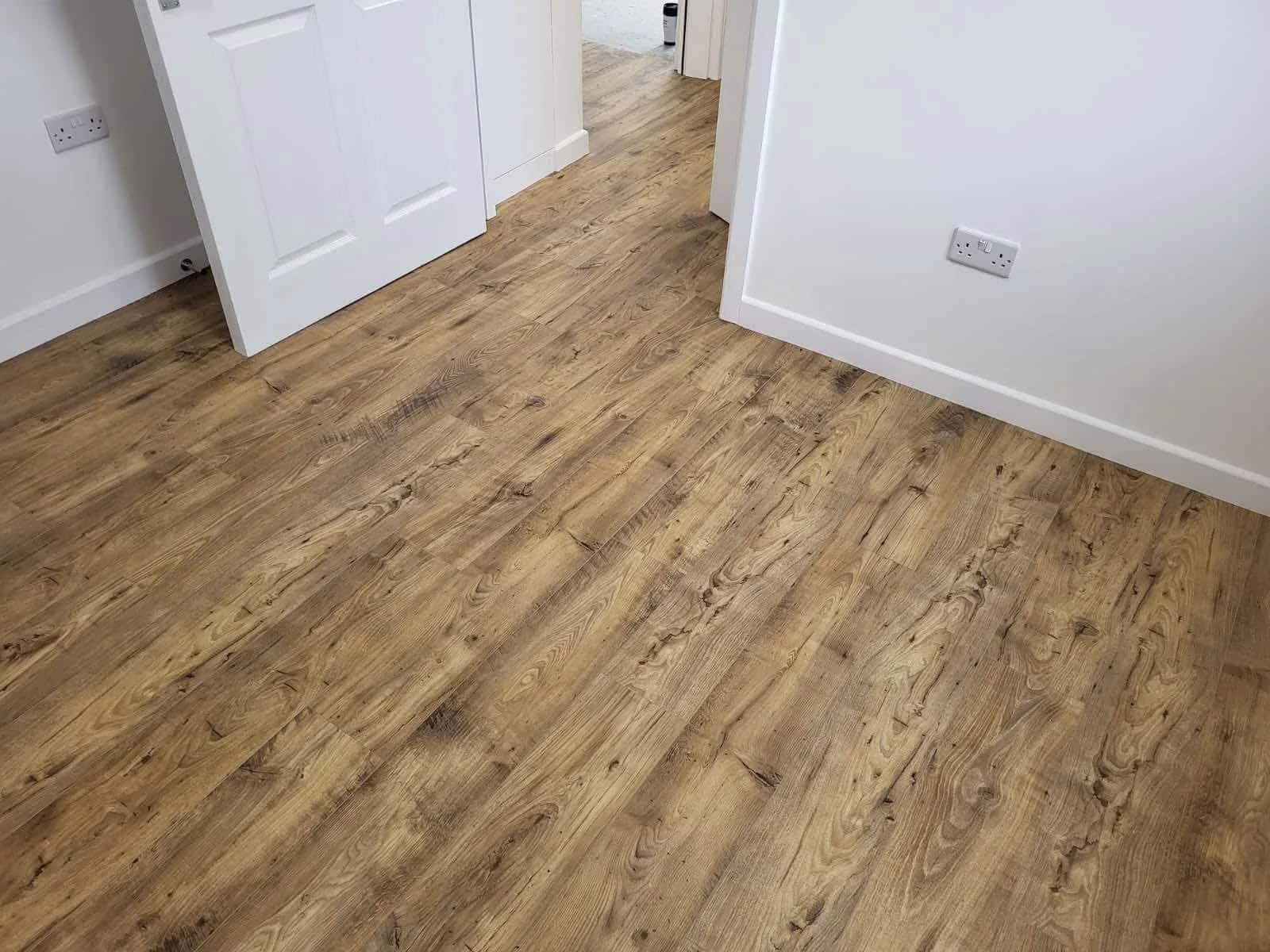 Oak effect laminate boards running through a hallway