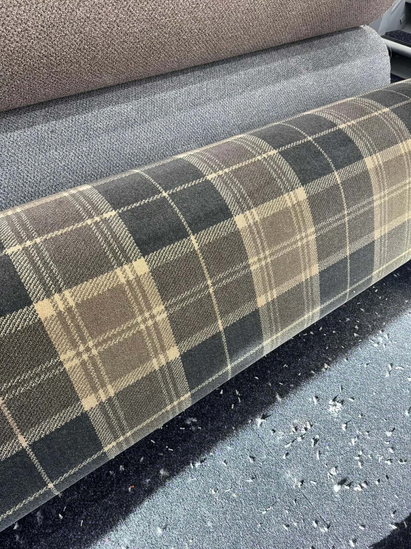 A tartan carpet roll on the showroom floor