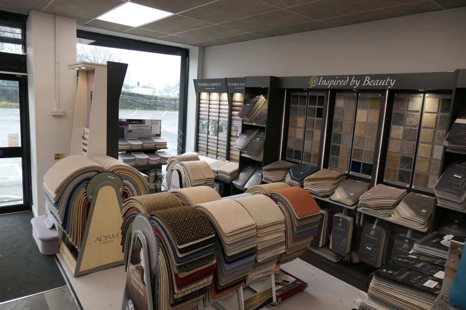 Roll ends and rugs stacked on the showroom floor