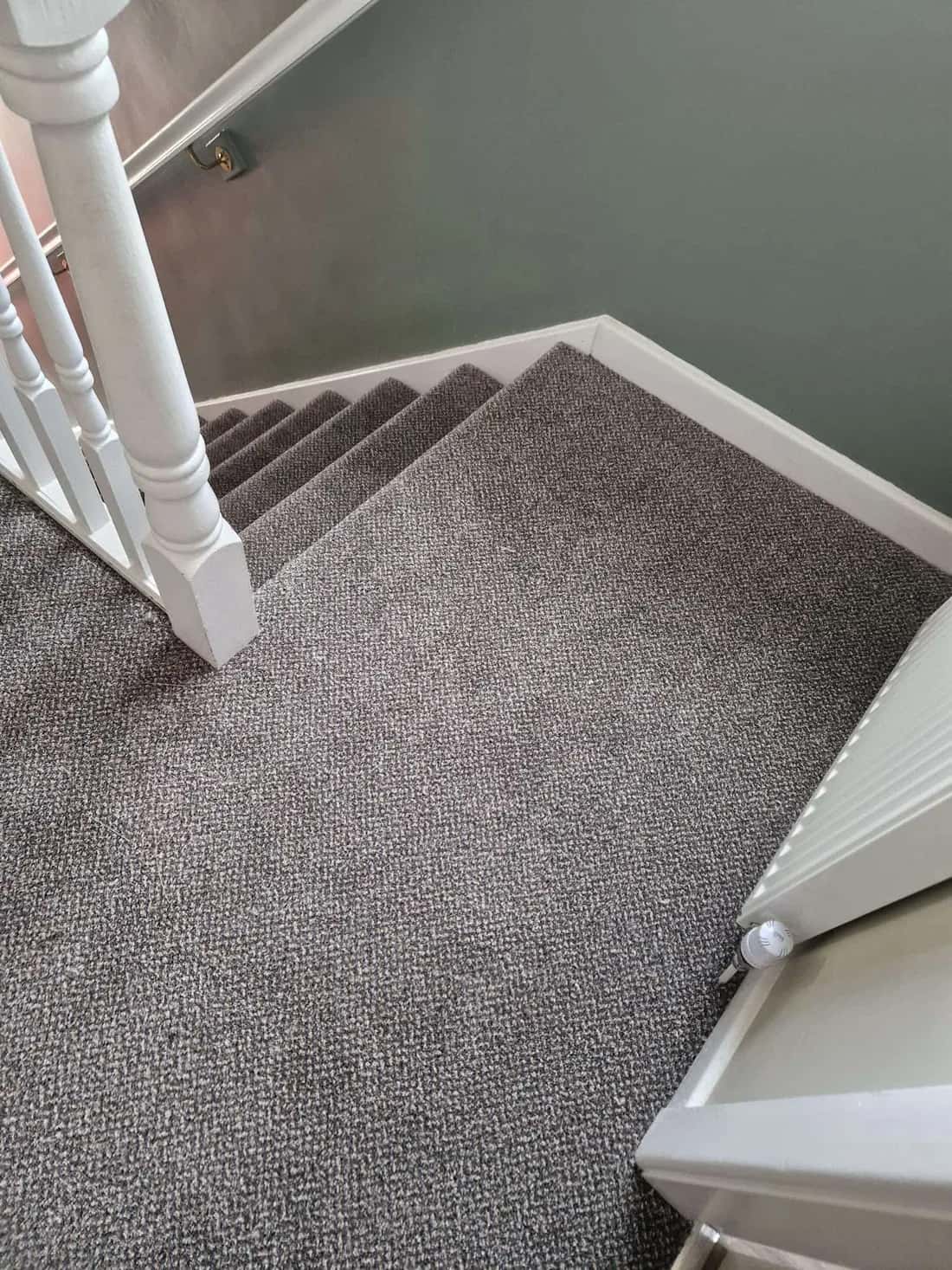 A finished staircase seen from the landing