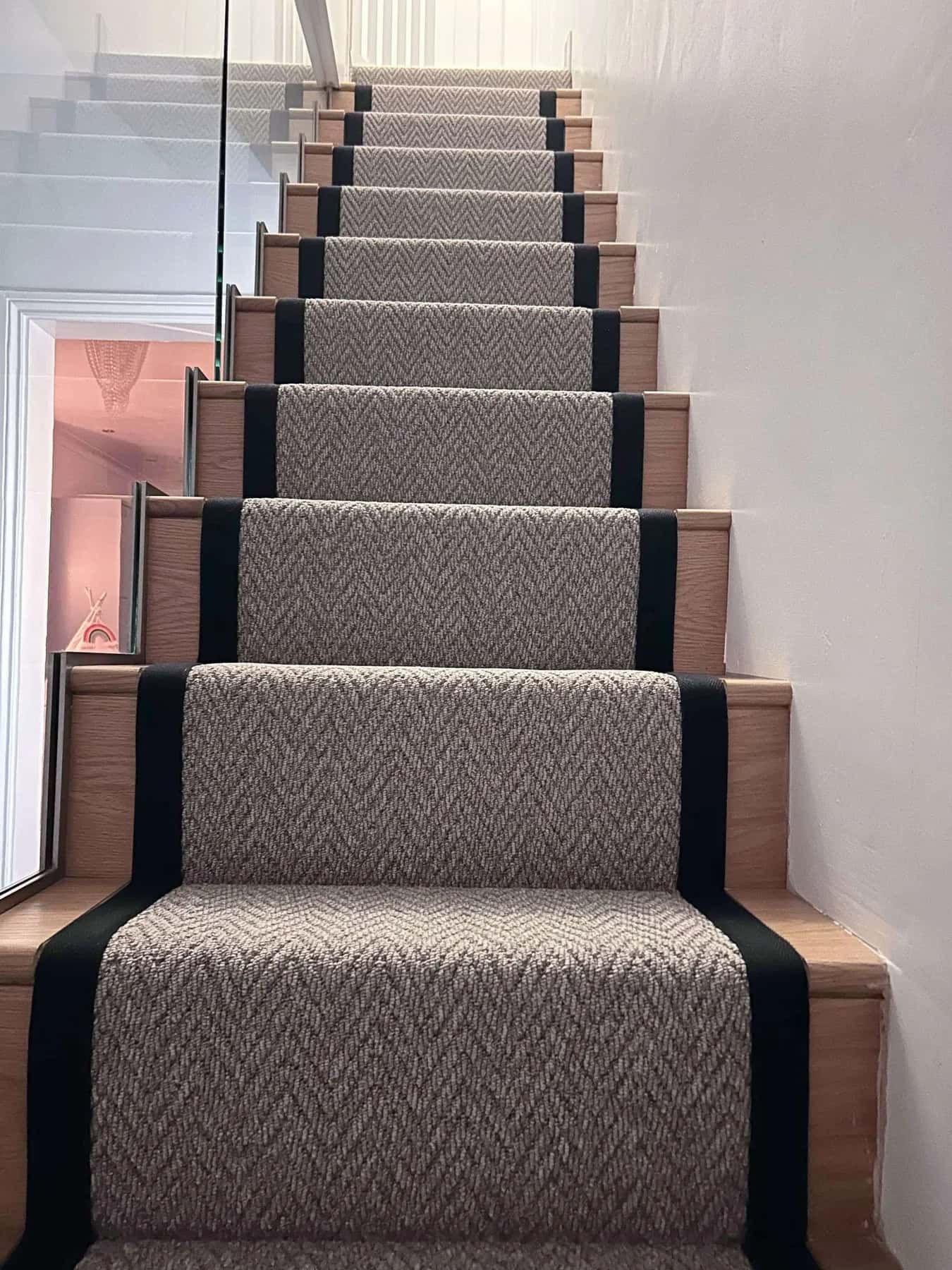 A herringbone runner with a dark border on a straight flight