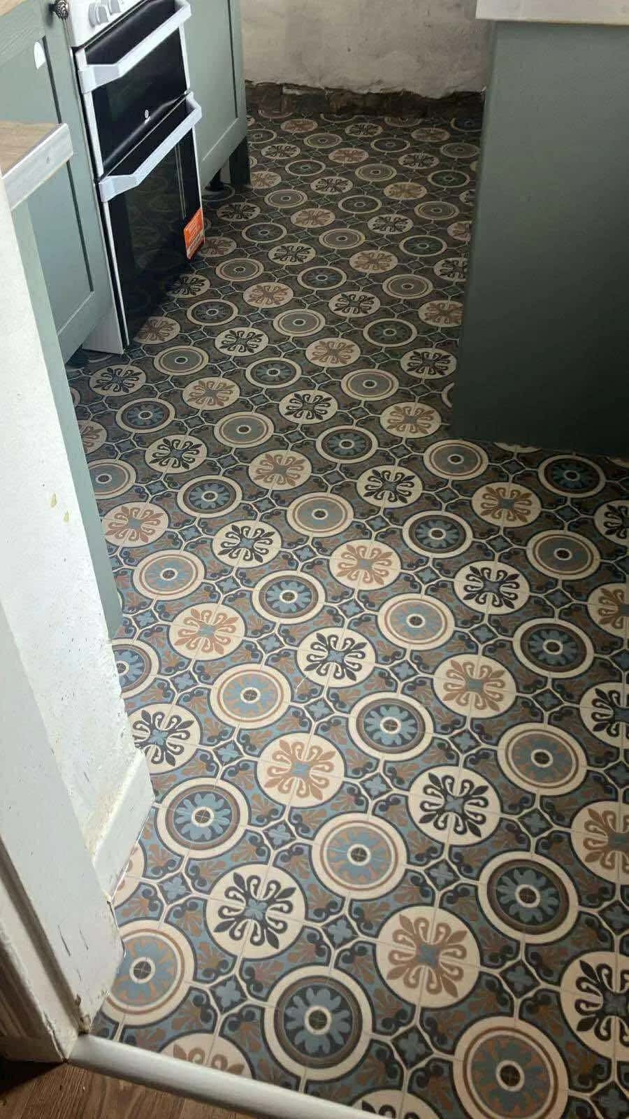 Ornate Victorian pattern vinyl in teal and gold, fitted wall to wall