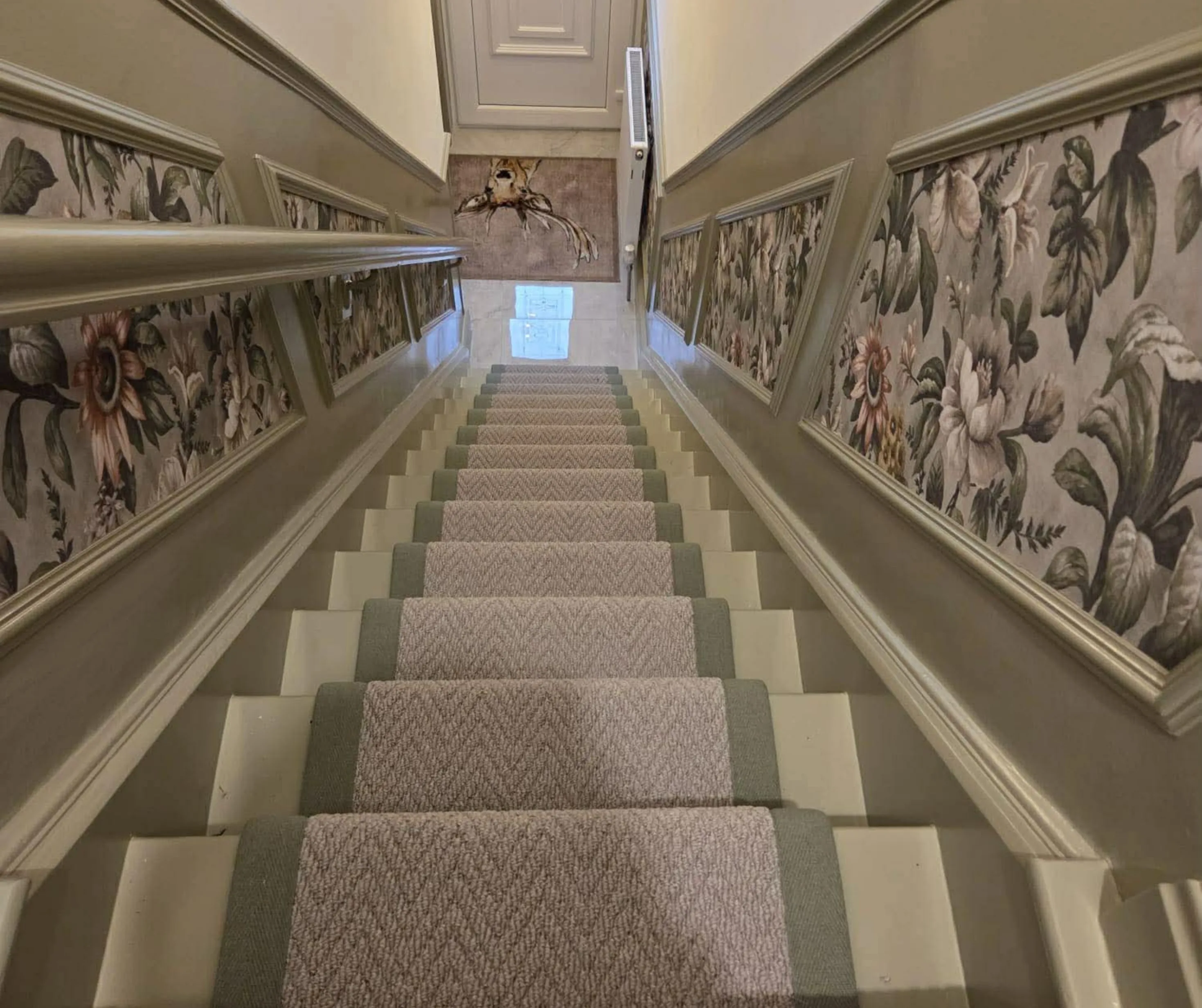 Herringbone stair runner with patterned wallpaper