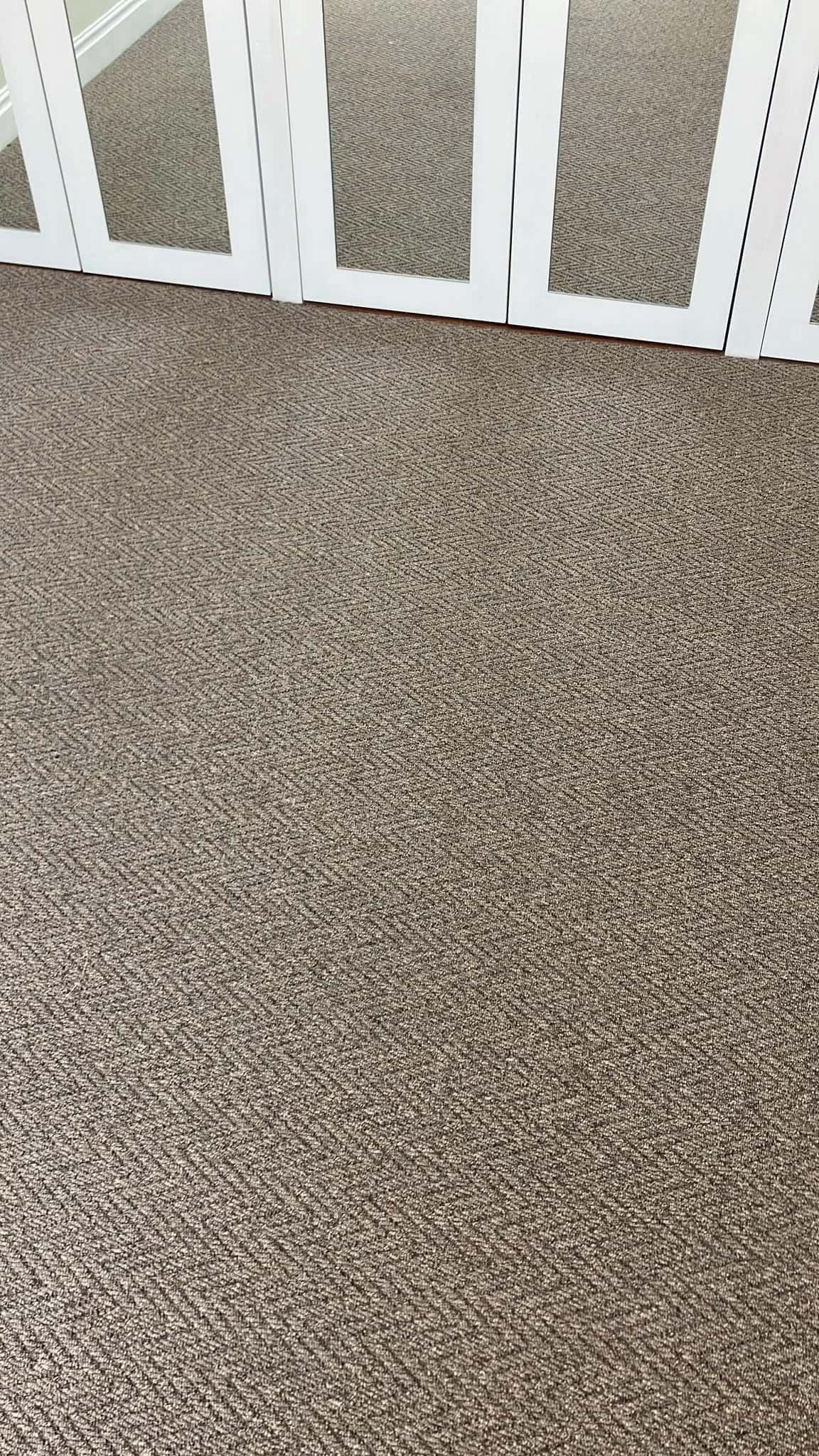 Herringbone carpet fitted up to panelled doors