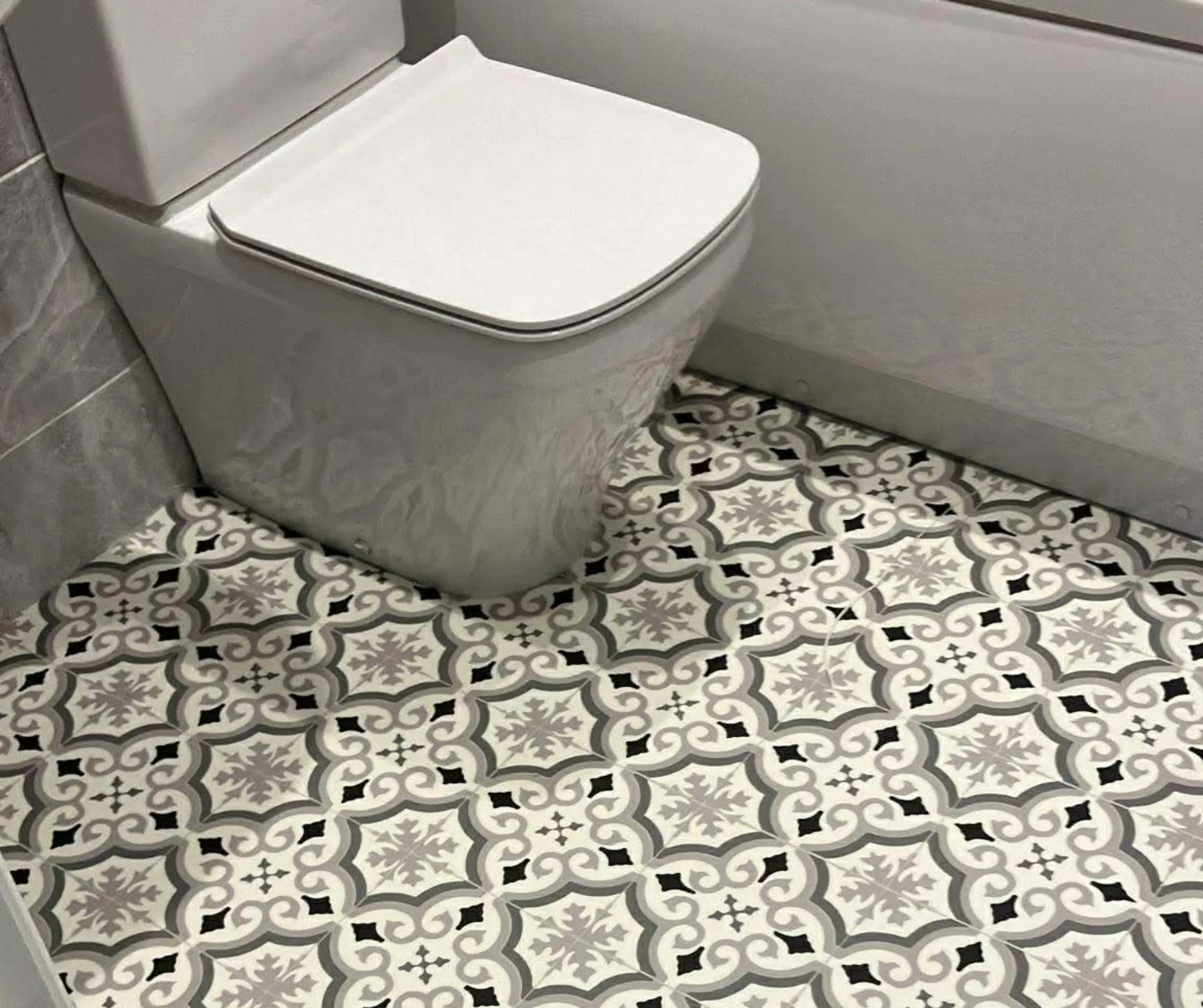 Patterned vinyl fitted around a bathroom suite