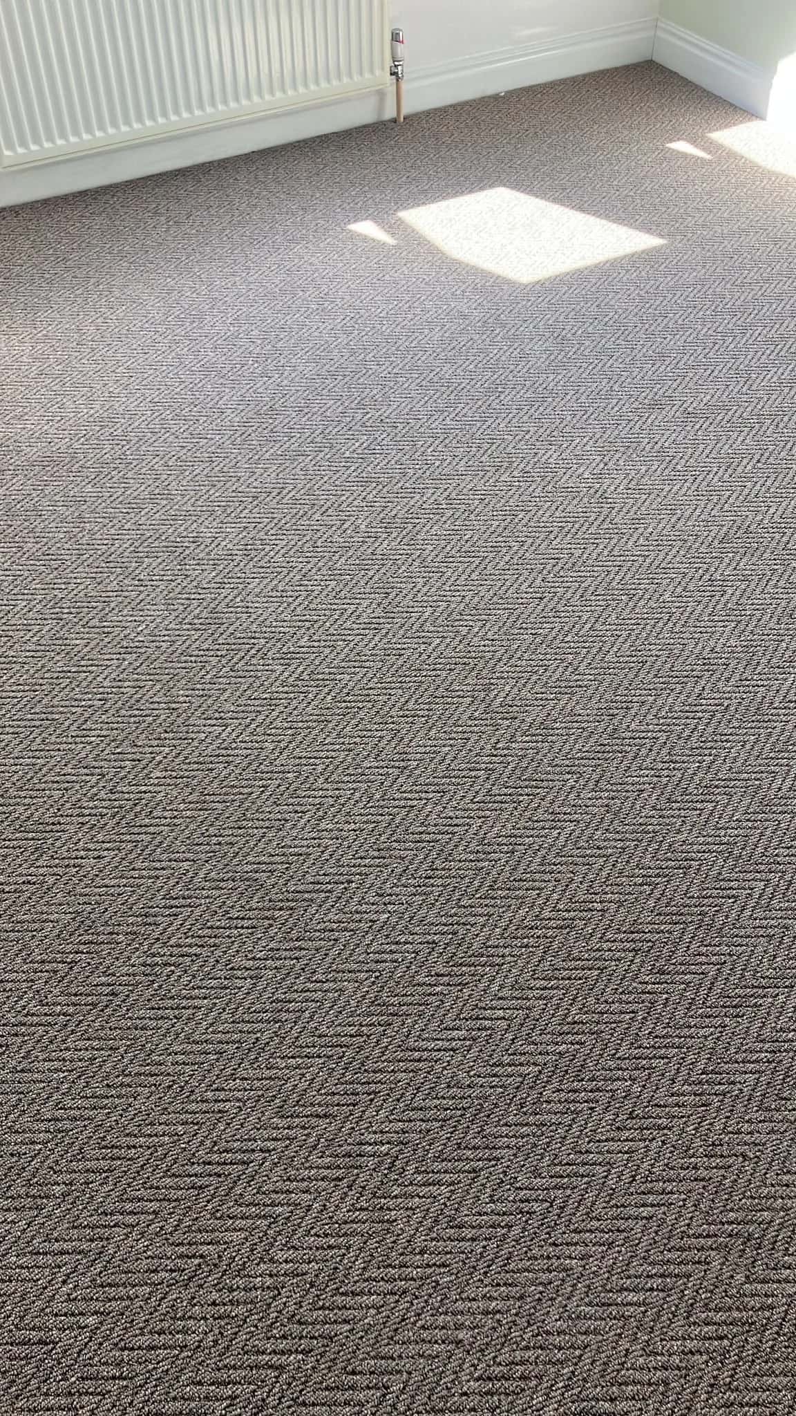 Herringbone carpet across a landing