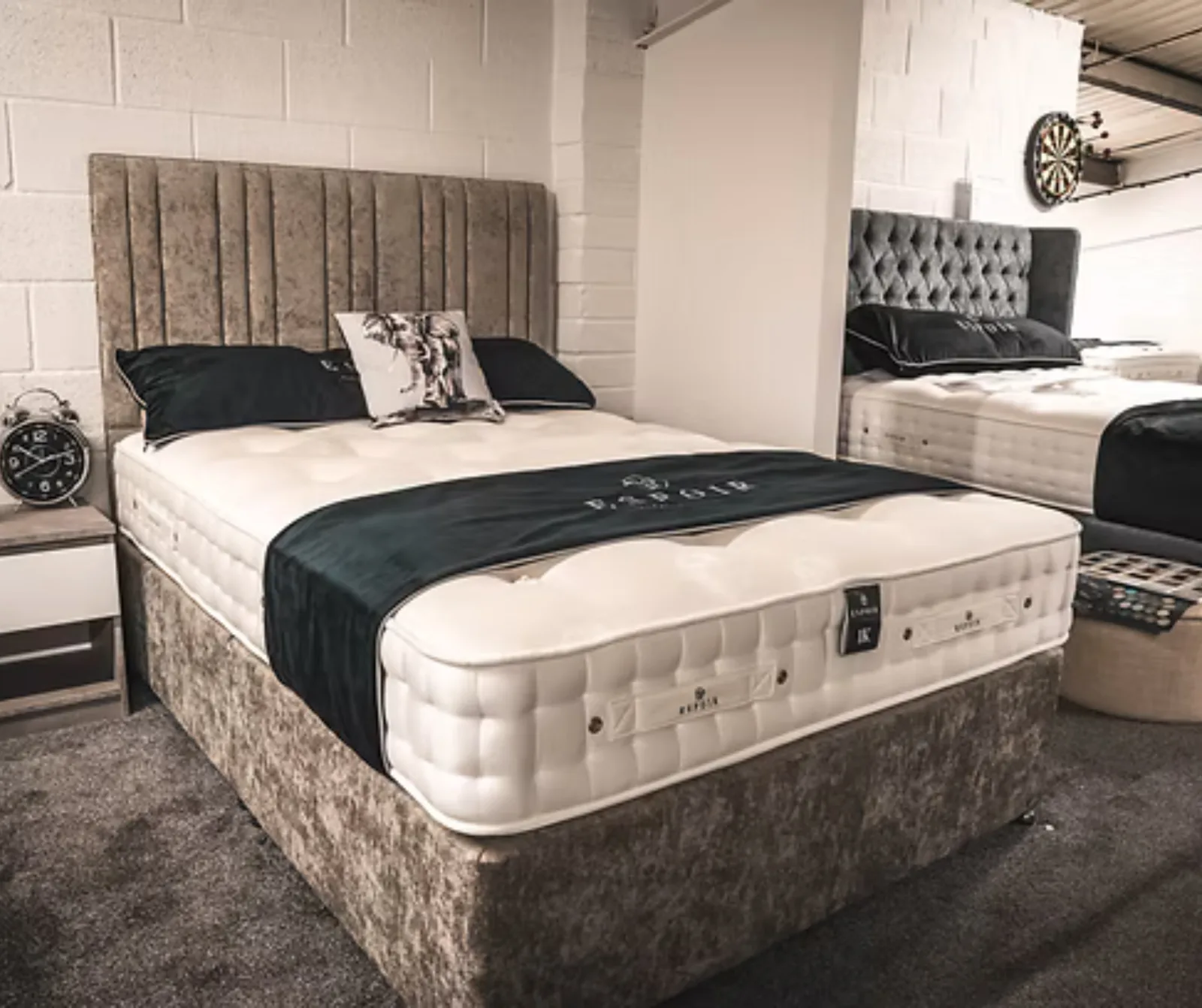 Divan bed and buttoned headboard on the showroom floor