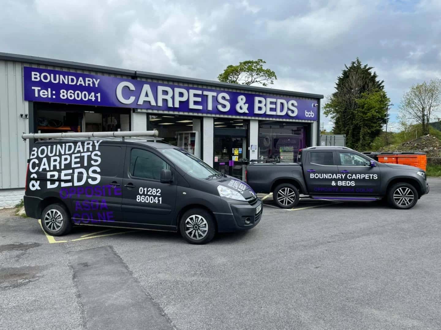The Boundary Carpets and Beds shopfront with the fitting vans outside