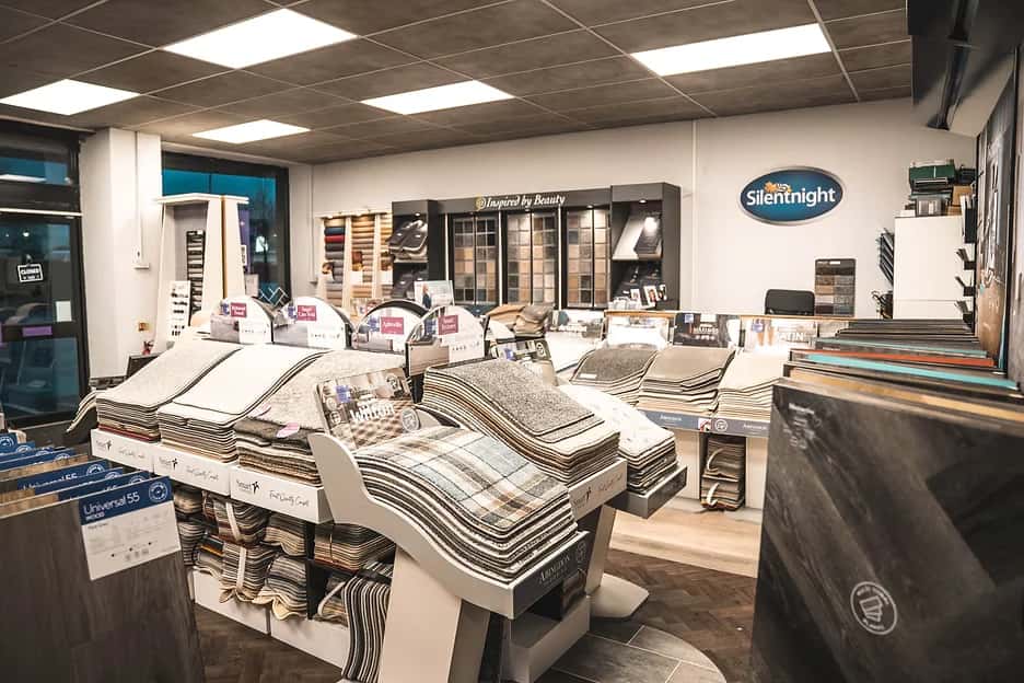 Bed displays and carpet sample bays in the showroom